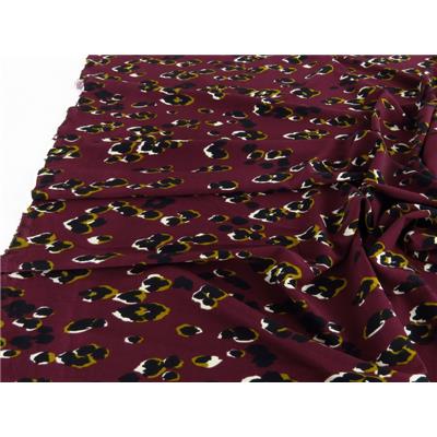 Tissu Crepe Crinkle Abstrait Bordeaux